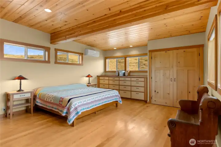 Main-floor bedroom with mountain views & built-in cabinetry.