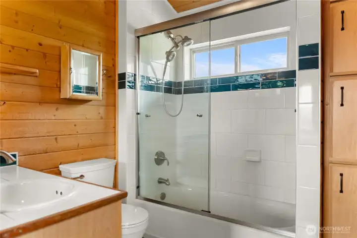 Upstairs bath with tub/shower combination.