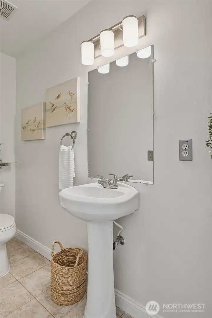 Downstairs powder room (1/2 bath) with ceramic tile floor
