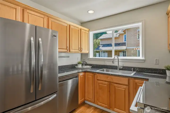 French door fridge and plenty of cabinets