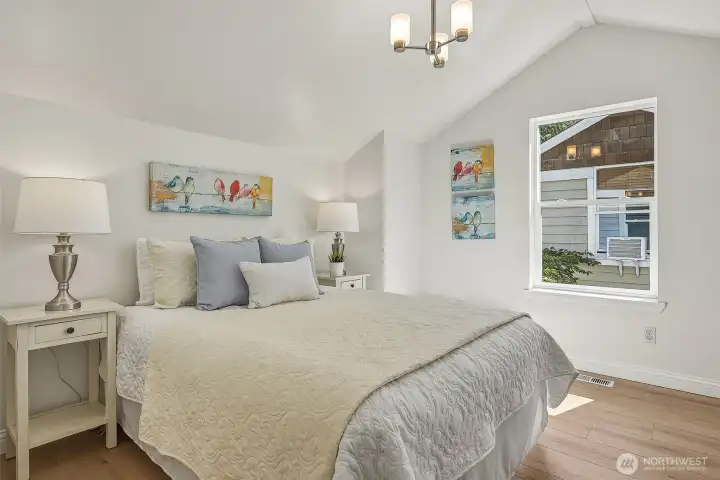 The third bedroom features vaulted ceilings, giving the space an open, airy feel