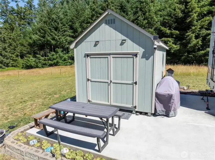 Outbuilding with plumbing, currently used for laundry facilities