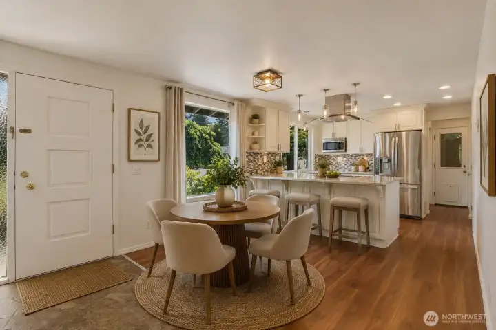 Virtually Staged - Dining room and kitchen with eating bar. Virtually Staged - Dining room and kitchen with eating bar.