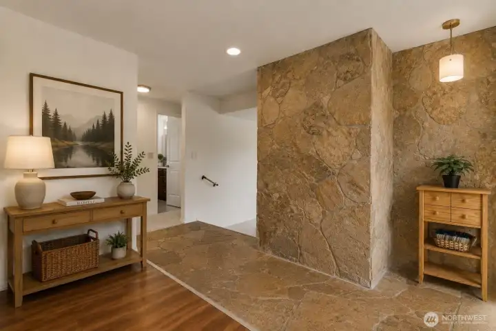 Virtually Staged - Two steps down into the sunken living room with wood burning fire insert. Virtually Staged - Two steps down into the sunken living room with wood burning fire insert.