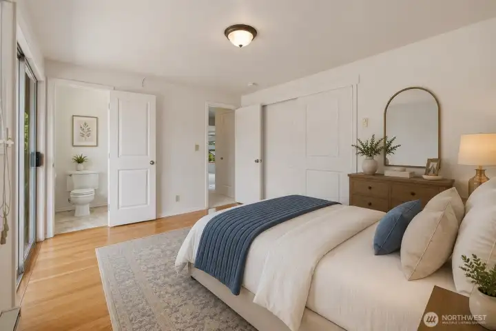 Virtually Staged - Primary bedroom with 1/2 bathroom. Possibly room to add a shower in this bathroom? Virtually Staged - Primary bedroom with 1/2 bathroom. Possibly room to add a shower in this bathroom?