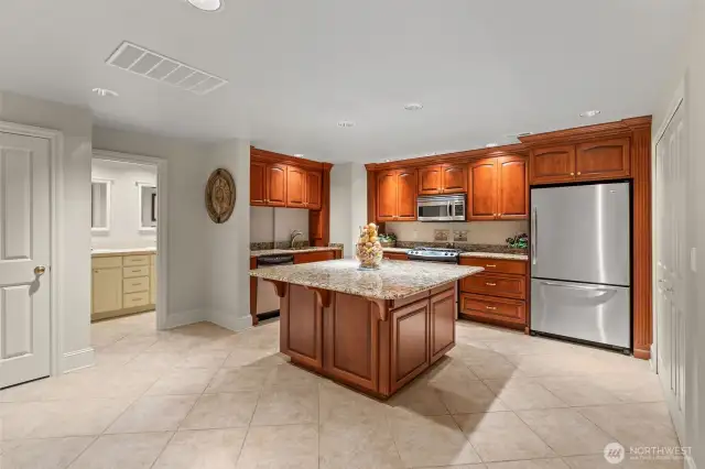 Incredible large-screen theater room! Soundproofed, with eight heated, reclining, massage chairs, delightful granite eating bar, and custom AV-equipment that all stays with the home.