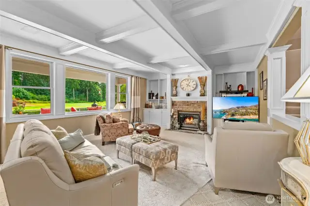 Stunning family room with coffered ceiling, custom built-in cabinetry, quality sculpted carpeting and wall-of-windows view of the backyard and 15th green. This room and the adjoining fully open main kitchen are perfectly designed to be the heart of this fine home.