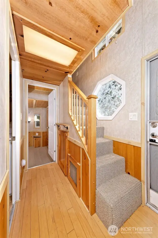 Stairs to sleeping loft. Hallway to bedroom and bath