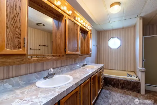 Primary en-suite with dual vanity, garden tub & separate shower