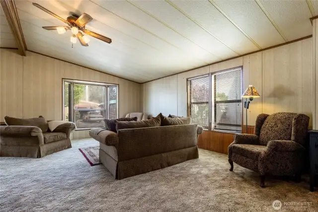 Open floor plan, ample windows letting in natural light.
