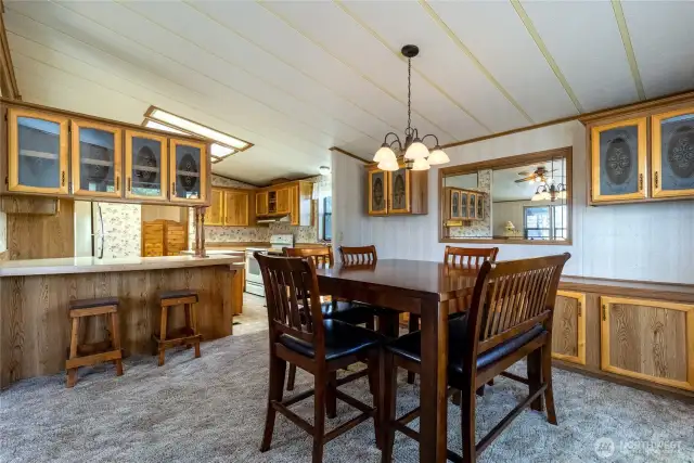 Dining room with built-in cabinets, mirror & hutch