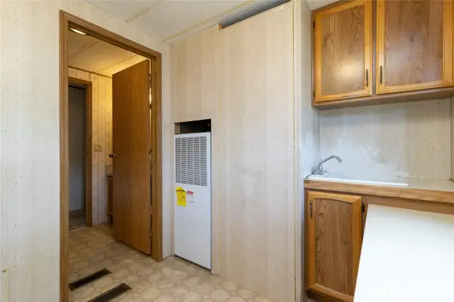 Laundry leads into full guest bath