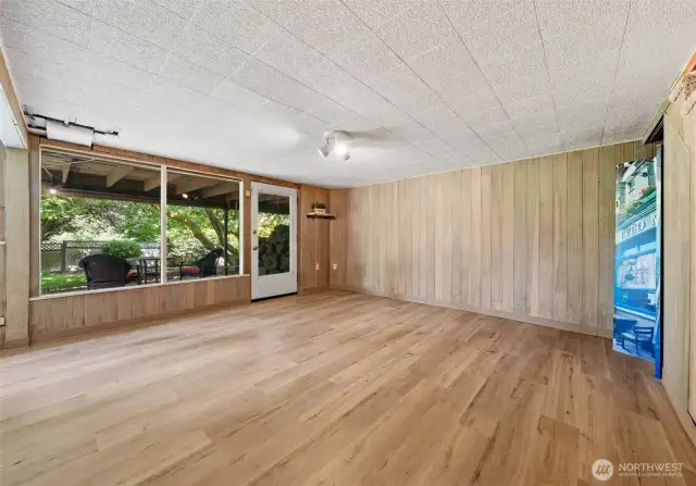 Lower level primary suite with large windows, two closets and an impressive brand new bathroom.