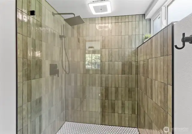 New step-in oversized shower in the primary bath.