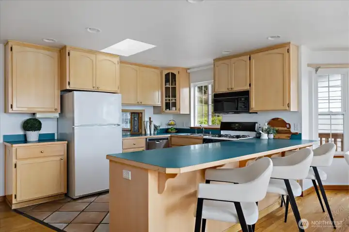 Nice rustic terra cotta tile floors in the kitchen.