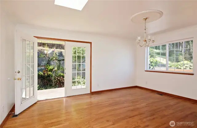 Formal dining room looks out onto the large back yard.