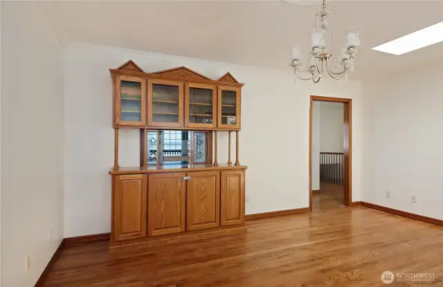 Pretty chandelier and wood floors in your formal dining area.