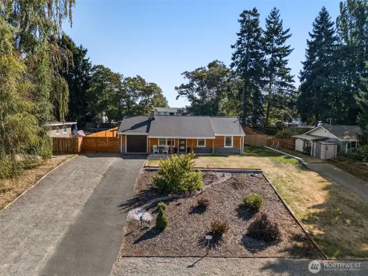 Look at this front yard! Home sets back from the street, new landscaping, plenty of parking for cars or even an RV or trailer!