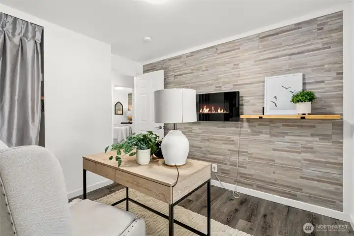Bedroom number three with Electric fireplace on wall, completely remodeled