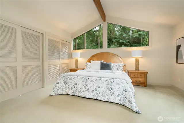 Primary bedroom with wall of closets.