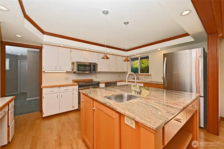 Plenty of countertops and storage and an island with sink for extra prep space!