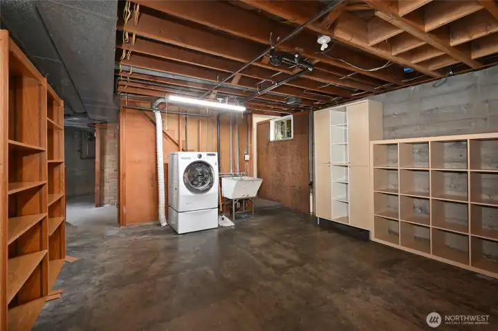 Lower level with high ceilings, perfect to finish off and make more livable space.