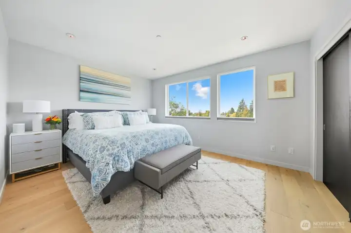 Primary bedroom with views of Olympic Mountains