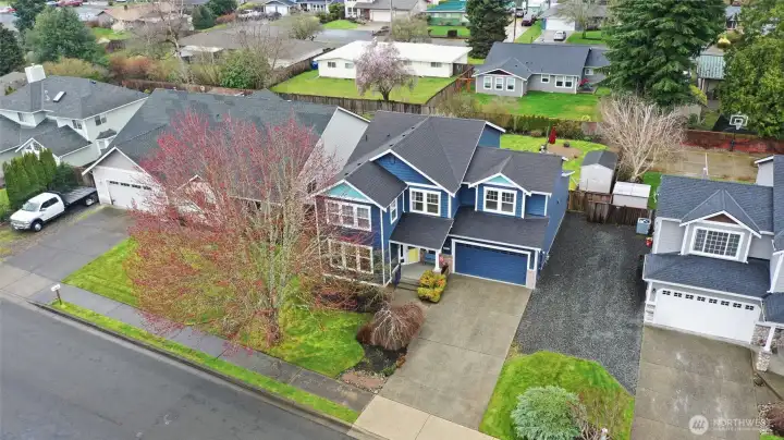 Aerial view shows the spacious RV or boat parking available on the right side. Plus curbs and sidewalks across the neighborhood for safe and enjoyable walks!