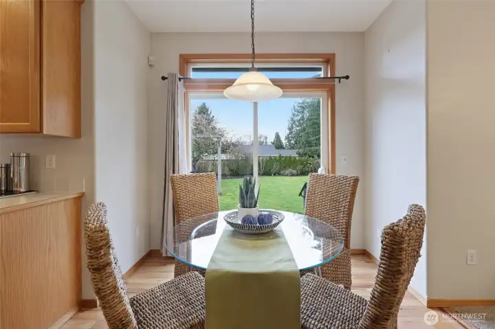 Adorable breakfast nook! Imagine the sliding doors open to the patio on warm summer months!