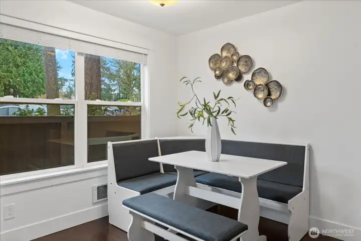 Cheery dining space with views to patio and beyond.
