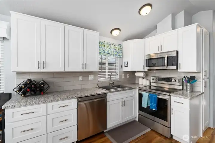 Open concept kitchen with stainless steel appliances