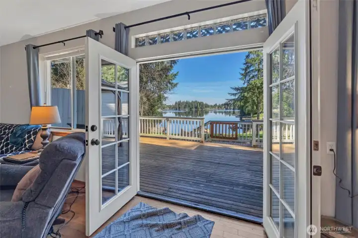 Main floor French doors opening to deck with lake view