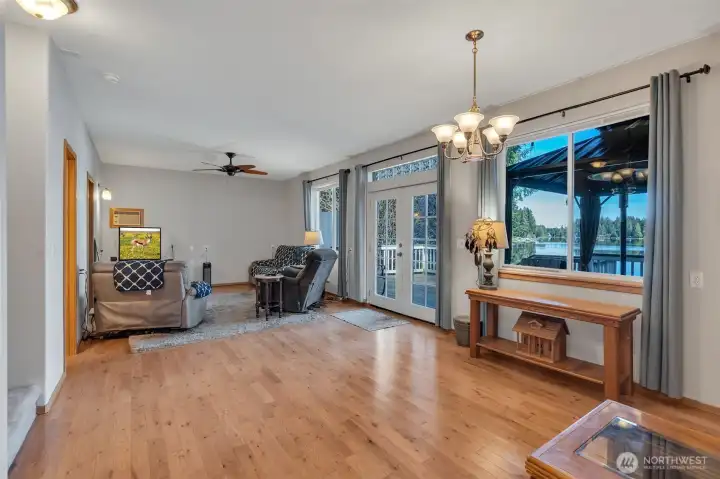 Living and dining area with lake-facing windows