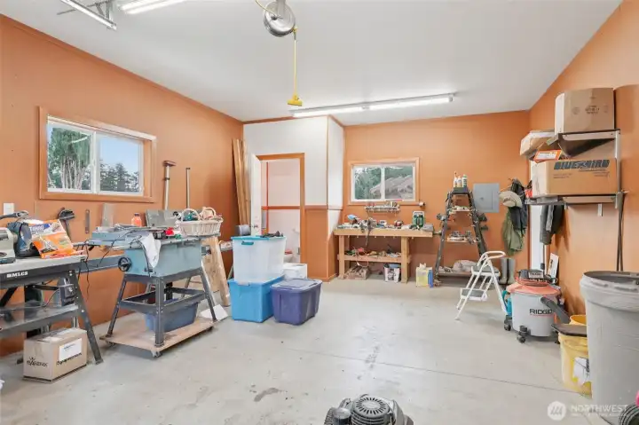The third bay of the garage is being used as a workshop.