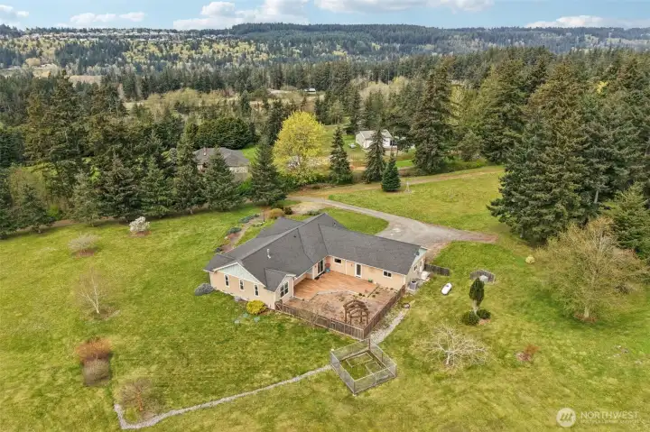 Plenty of space to entertain on the back deck or patio. Garden beds, and more!