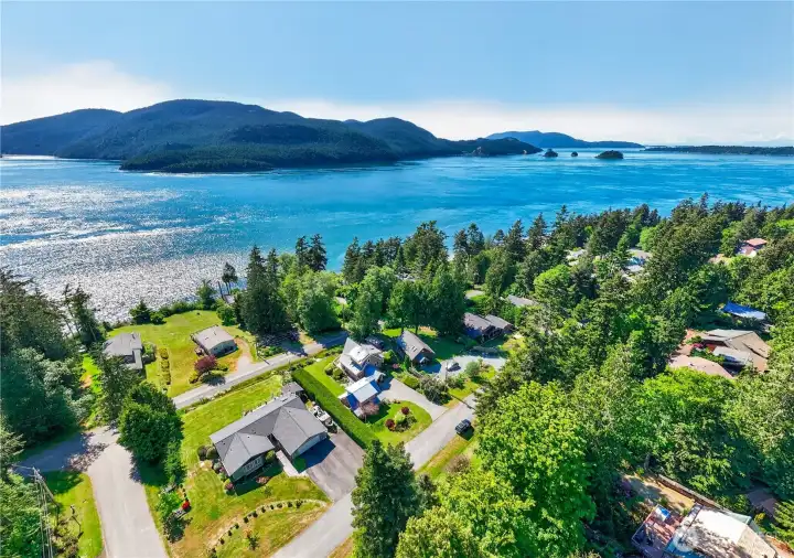 One house off of the amazing waters of the channelWith Cypress Isand, Orcas Island & the Cone Islands.  Home & garage to right of the green hedge in middle of frame.