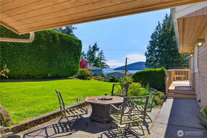 Patio and pathway lead to side & front deck.