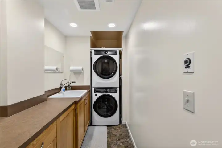 Big laundry room with lots of counter space, deep sink & newer washer & dryer.