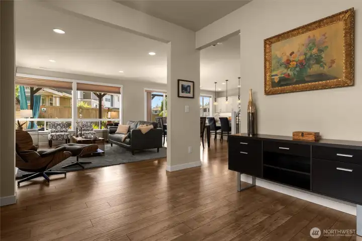 An abundance of natural light and gorgeous views of lush back yard from stunning great room wall of glass