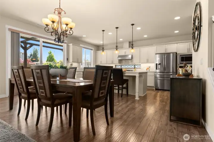 Beautiful wood-look laminate flooring throughout the main living areas provide low-maintenance convenience and inviting atmosphere