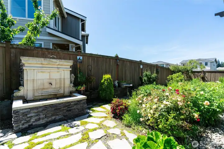The tranquil sound from this large fountain offers a pleasant, private oasis feel to the back yard