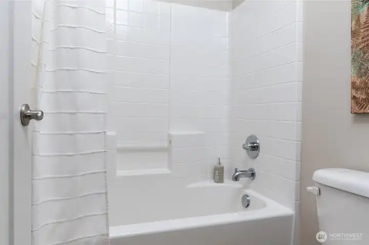 Main upstairs full bath offers a private tub/ toilet area, separate from vanities for convenience