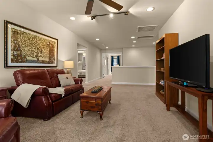 A comfortable space for congregating, this centrally located bonus room is ideal for movie or game night