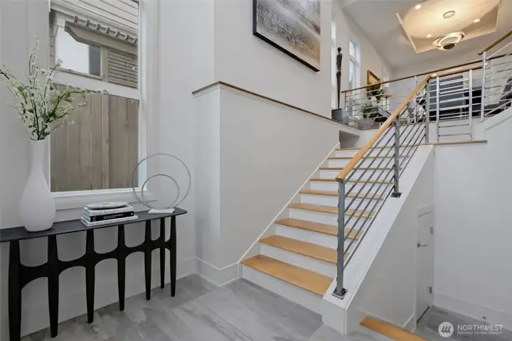From the moment you step inside, the craftsmanship is unmistakable. Italian tile and hardwoods to 2nd story accented with warm woods and iron ballisters.