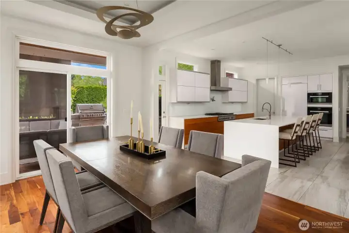 Gorgoues warmth meets form and function in this dining room that opens to the back patio and kitchen.