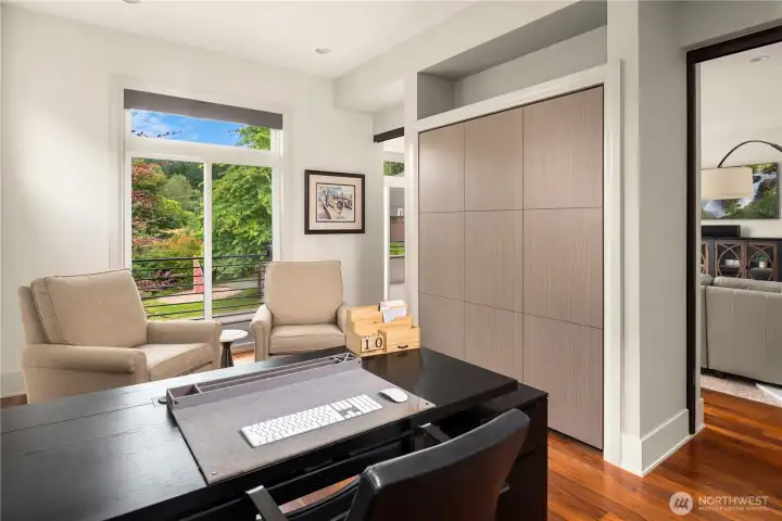 Built in Murphy Bed pulls down to create bedroom on main floor, served by walk-in shower and powder room on the main living floor