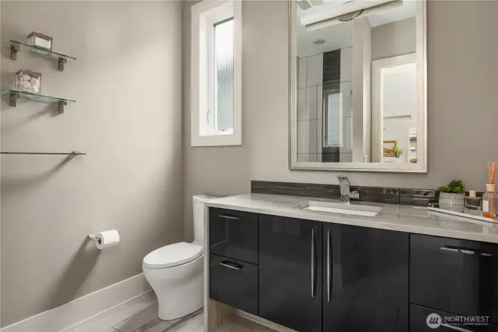 Powder room + walk in shower on main floor living.