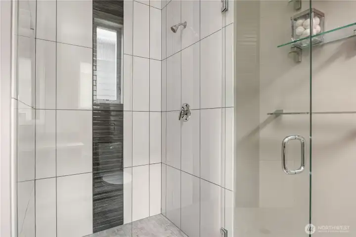 Shower in powder room on 2nd story. Served by murphy bed in office - for a guest suite.