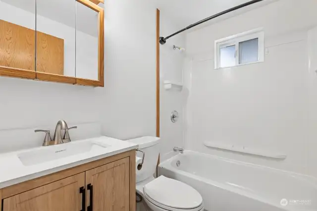 The full bath has a new vanity and there is a full size tub/shower.
