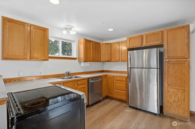 The kitchen has stainless appliances and the fridge and range are about 1.5 years old and the dishwasher is new.